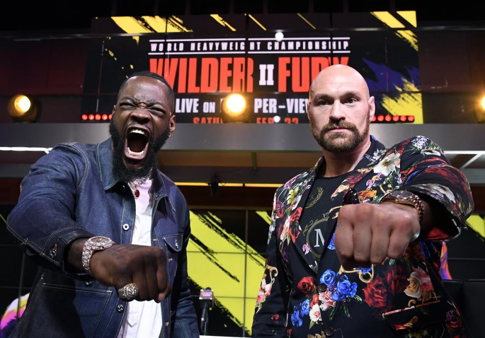 Deontay Wilder & Tyson Fury Get Heated Ahead Of Rematch: Watch