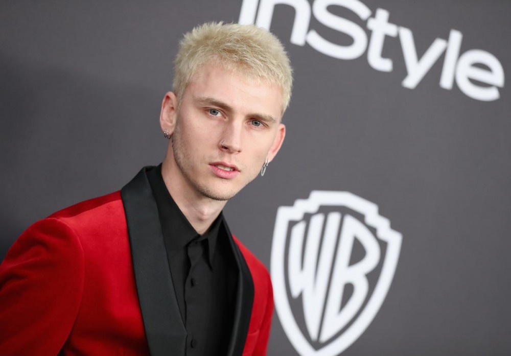Machine Gun Kelly Swims With Pigs While Vacationing In The Bahamas