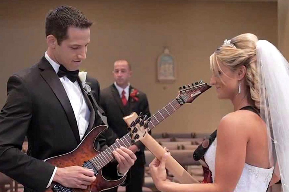 Watch This Shred-Tastic Wedding Entrance With Bride + Groom Guitarists