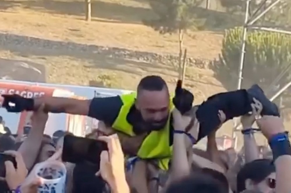 Watch Security Guard Crowd Surf at Metal Festival